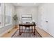 Well-lit office space with a classic desk, neutral walls, and ample natural light at 1425 Burt Ave, Berthoud, CO 80513