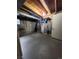 Unfinished basement with visible concrete walls and ceiling and utility equipment at 1240 S Idalia St, Aurora, CO 80017
