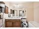 Full bathroom with double sink vanity and combination tub and shower at 1240 S Idalia St, Aurora, CO 80017