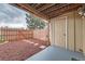 Cozy outdoor patio space with a small garden area and secure fence at 1240 S Idalia St, Aurora, CO 80017