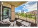 Balcony with seating area showcasing city views and nearby buildings at 8100 E Union Ave # 310, Denver, CO 80237