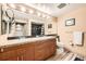 Bathroom with double sinks, granite countertops, tile floor, and a shower at 8100 E Union Ave # 310, Denver, CO 80237