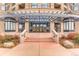 Inviting entrance to Penterra Plaza, showcasing the covered walkway, manicured landscaping, and grand doorway at 8100 E Union Ave # 310, Denver, CO 80237