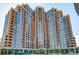 A stunning full exterior view of the high-rise Penterra Plaza building showing all the balcony's and windows at 8100 E Union Ave # 310, Denver, CO 80237