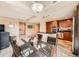 Spacious kitchen featuring sleek appliances and modern countertops next to a dining area with a glass table and chairs at 8100 E Union Ave # 310, Denver, CO 80237
