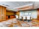 Conference room with large table, chairs, and a kitchenette in the background at 8100 E Union Ave # 310, Denver, CO 80237