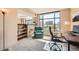 Office space with bright window offering natural light, and a comfortable chair that creates an ideal workspace at 8100 E Union Ave # 310, Denver, CO 80237