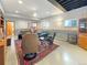 Spacious basement with comfortable seating, finished floors, and partial kitchen area at 14475 Crabapple Rd, Golden, CO 80401