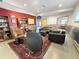 Open basement space with eclectic decor, comfortable seating, and functional layout at 14475 Crabapple Rd, Golden, CO 80401