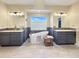 Bright bathroom boasts a soaking tub, dual vanities, and a large window at 14475 Crabapple Rd, Golden, CO 80401