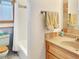 Functional bathroom featuring a tiled shower/tub, toilet, and wood vanity with sink at 14475 Crabapple Rd, Golden, CO 80401