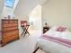 Cozy bedroom with a comfortable bed, a dresser, and a window seat at 14475 Crabapple Rd, Golden, CO 80401