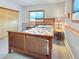 Cozy bedroom with wood trim, a large bed, and natural light from the window at 14475 Crabapple Rd, Golden, CO 80401