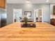 Butcher block island with a floral arrangement in front of doorways at 14475 Crabapple Rd, Golden, CO 80401