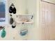 Charming entryway featuring a corner shelf, coat hooks, and closet storage at 14475 Crabapple Rd, Golden, CO 80401