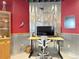 Modern home office setup with a monitor, desk, rolling chair, and unique decorations at 14475 Crabapple Rd, Golden, CO 80401