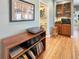 Cozy living area with hardwood floors, a record player, and a view of the adjacent dining area at 14475 Crabapple Rd, Golden, CO 80401