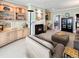 Bright living room with built-in shelving and a fireplace for a cozy ambiance at 14475 Crabapple Rd, Golden, CO 80401