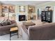Inviting living room featuring a fireplace, built-in shelving, and comfortable seating at 14475 Crabapple Rd, Golden, CO 80401