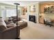 A comfortable living space with a fireplace and large windows for natural light at 14475 Crabapple Rd, Golden, CO 80401