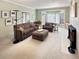 Bright living room with neutral tones, comfortable seating, and a fireplace, perfect for relaxation at 14475 Crabapple Rd, Golden, CO 80401