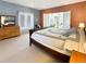 Spacious main bedroom featuring a brick accent wall and french doors at 14475 Crabapple Rd, Golden, CO 80401