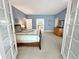 Bright main bedroom offering views of the ensuite bath from the French doors at 14475 Crabapple Rd, Golden, CO 80401