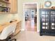 Office featuring a built-in desk with three drawers next to a curio cabinet at 14475 Crabapple Rd, Golden, CO 80401