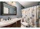 Nautical-themed bathroom with decorative shower curtain and a modern vanity at 2016 W 101St Ave, Thornton, CO 80260