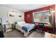 Bedroom boasts a cozy layout with a window view, desk, and comfortable bed at 2016 W 101St Ave, Thornton, CO 80260