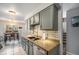 Well-appointed kitchen area with granite countertops, stainless steel appliances, and warm lighting at 2016 W 101St Ave, Thornton, CO 80260