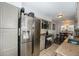 Bright kitchen with stainless steel appliances, granite countertops, and convenient access to the dining area at 2016 W 101St Ave, Thornton, CO 80260