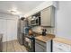 Efficient kitchen design, showcasing stainless steel appliances, ample counter space, and practical storage solutions at 2016 W 101St Ave, Thornton, CO 80260