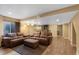 Finished basement featuring a large sofa, wood floors, and a projector setup at 18496 Keyser Creek Ave, Parker, CO 80134