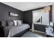 Stylish bedroom with a daybed, modern decor, and a large window at 18496 Keyser Creek Ave, Parker, CO 80134