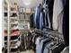 Organized walk-in closet with ample shelving and hanging space for clothes and accessories at 18496 Keyser Creek Ave, Parker, CO 80134