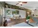 Open living space with a large TV, comfortable seating, stylish decor, and view to the hall at 18496 Keyser Creek Ave, Parker, CO 80134