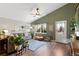 Cozy living room features a large window, comfortable seating, stylish decor, and a guitar at 18496 Keyser Creek Ave, Parker, CO 80134