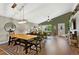 Combined dining and living area showcasing an open layout, stylish decor, and a large dining table at 18496 Keyser Creek Ave, Parker, CO 80134