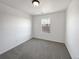 Clean bedroom with neutral walls, a window, and plush carpeting at 12713 Leyden St # E, Thornton, CO 80602
