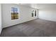 Bright bedroom featuring two large windows, perfect for natural light at 12713 Leyden St # E, Thornton, CO 80602