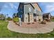 Charming townhouse with stone details, blue siding, and a well-maintained landscape at 12713 Leyden St # E, Thornton, CO 80602