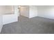 Large upstairs living room with lots of closet space and neutral carpeting at 12713 Leyden St # E, Thornton, CO 80602