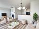 Bright, staged living room featuring modern furnishings and an open floor plan at 12713 Leyden St # E, Thornton, CO 80602