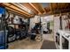Basement storage area with storage racks, exposed ceiling and adjacent bedroom at 1537 S Owens St # 31, Denver, CO 80232
