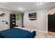Bedroom featuring a bed, large closet, television, and stylish decor at 1537 S Owens St # 31, Denver, CO 80232