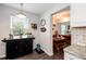 Bright breakfast nook featuring a window, a banquette seating and a table with access to the kitchen at 1537 S Owens St # 31, Denver, CO 80232