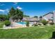 Outdoor community pool surrounded by lush greenery and a secure fence, perfect for relaxation and recreation at 1537 S Owens St # 31, Denver, CO 80232