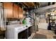 Basement laundry room with washer and dryer, plus ample storage space at 1537 S Owens St # 31, Denver, CO 80232
