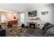 Comfortable living room featuring a fireplace, modern furniture, and wood-look floors at 1537 S Owens St # 31, Denver, CO 80232